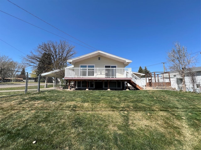 back of house with fence, stairs, a deck, a gate, and a yard