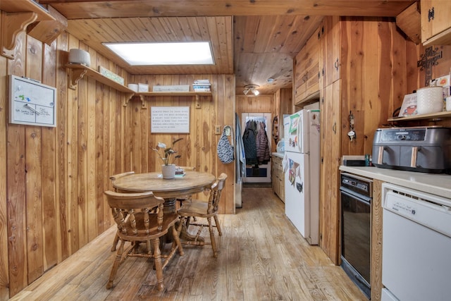 308 S 4th St, Hamilton, MT 59840 - kitchen featuring light wood-style floors, wood walls, wood ceiling, and white appliances