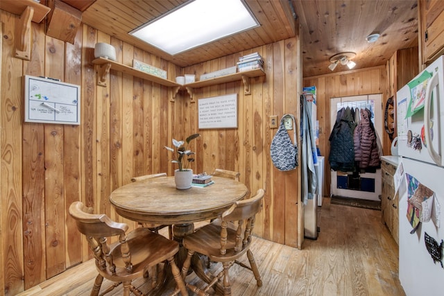 308 S 4th St, Hamilton, MT 59840 - dining room with wooden walls, wood ceiling, and light wood-style floors