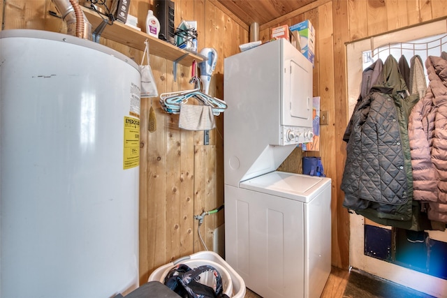 308 S 4th St, Hamilton, MT 59840 - washroom featuring wooden walls, laundry area, stacked washing maching and dryer, and water heater