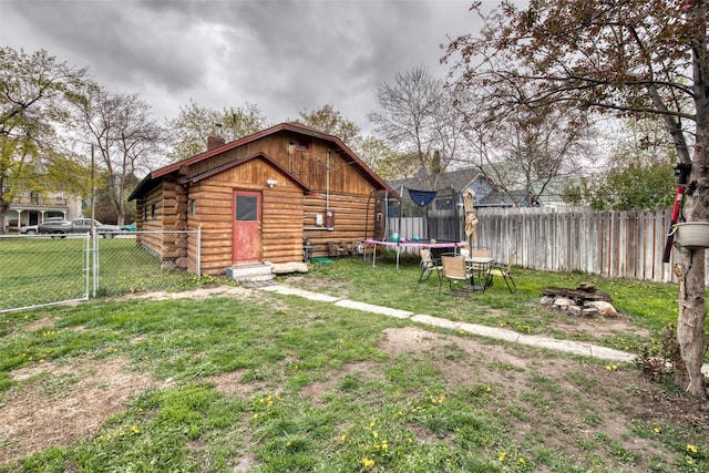 308 S 4th St, Hamilton, MT 59840 - view of yard with a fenced backyard and a trampoline