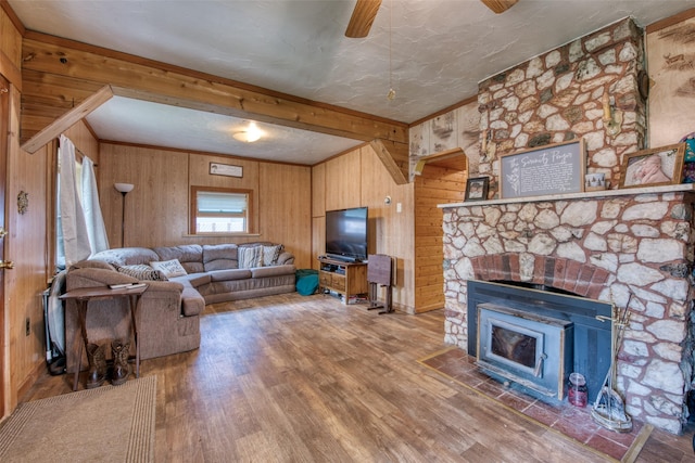 308 S 4th St, Hamilton, MT 59840 - living room featuring crown molding, wood walls, a ceiling fan, and wood finished floors