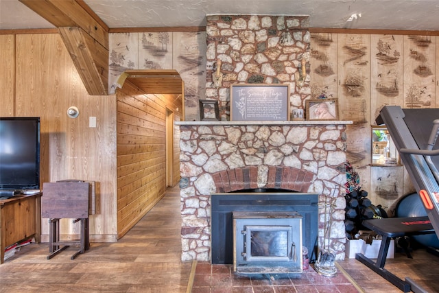 308 S 4th St, Hamilton, MT 59840 - living room with wooden walls, a stone fireplace, and wood finished floors