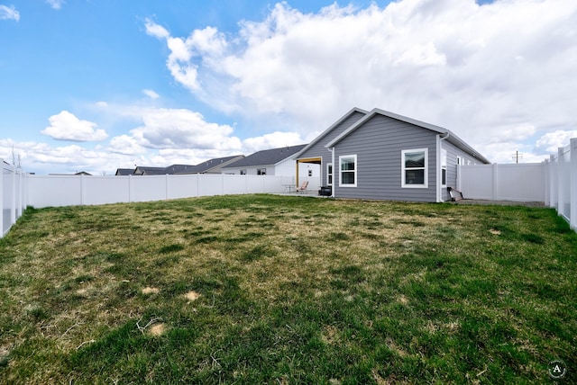 2800 Ashley Ave, East Helena, MT 59635 - rear view of house with a yard and a fenced backyard