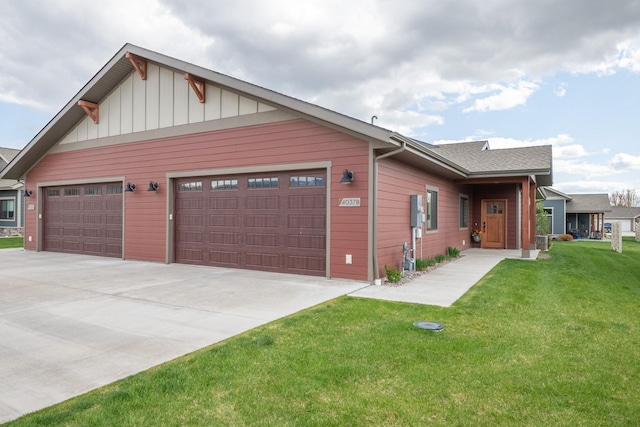4037 Valley View Ct Unit B, Missoula, MT 59808 - view of front of property featuring concrete driveway, an attached garage, board and batten siding, and a front lawn