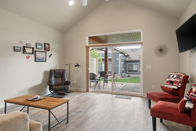 4037 Valley View Ct Unit B, Missoula, MT 59808 - living area with a ceiling fan, a fireplace, wood finished floors, high vaulted ceiling, and baseboards