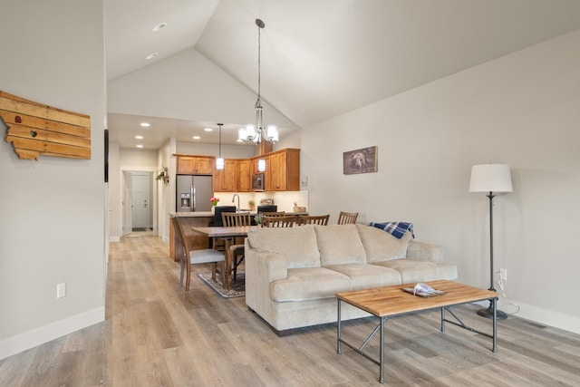 4037 Valley View Ct Unit B, Missoula, MT 59808 - living room with baseboards, recessed lighting, high vaulted ceiling, and light wood-style flooring
