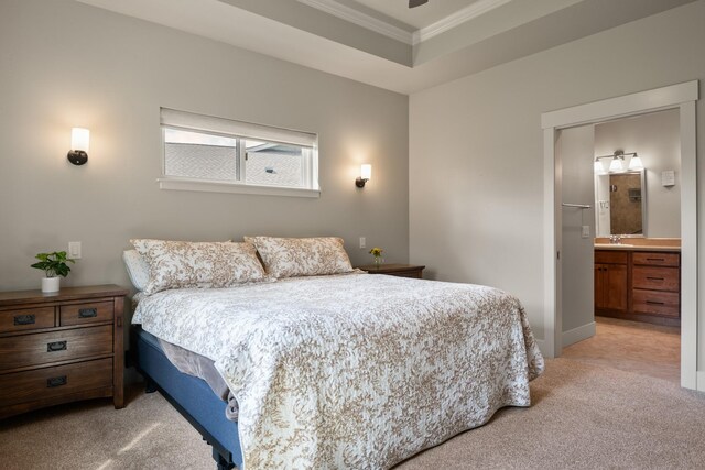 4037 Valley View Ct Unit B, Missoula, MT 59808 - bedroom featuring crown molding, light carpet, baseboards, ensuite bathroom, and a sink