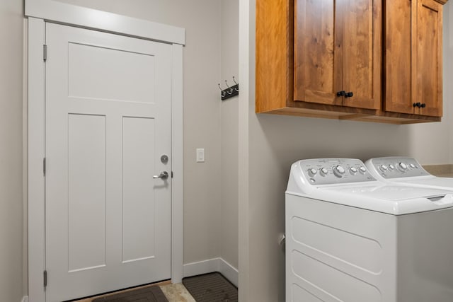 4037 Valley View Ct Unit B, Missoula, MT 59808 - clothes washing area featuring independent washer and dryer, baseboards, and cabinet space