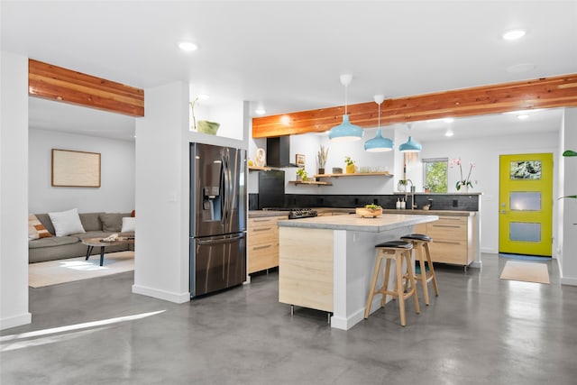 kitchen with open shelves, stainless steel fridge, modern cabinets, and wall chimney exhaust hood