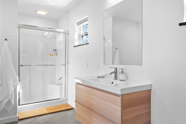full bathroom featuring vanity and a shower stall