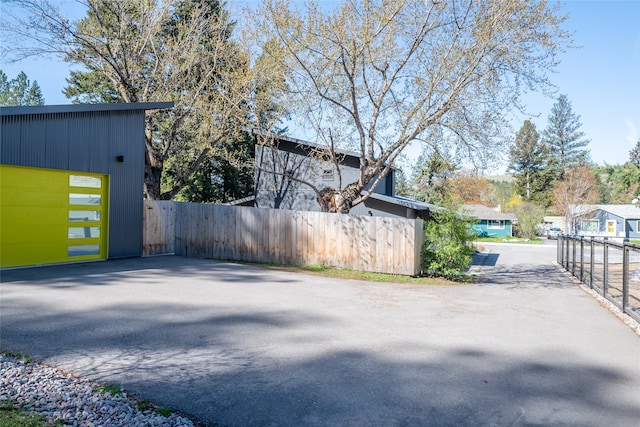 view of property exterior featuring fence