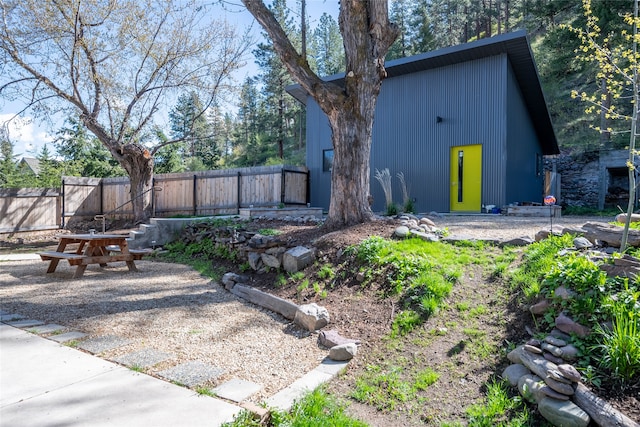 rear view of property with fence