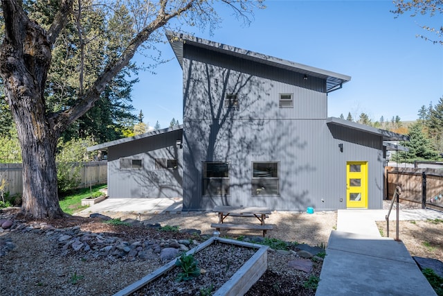 view of side of property featuring fence