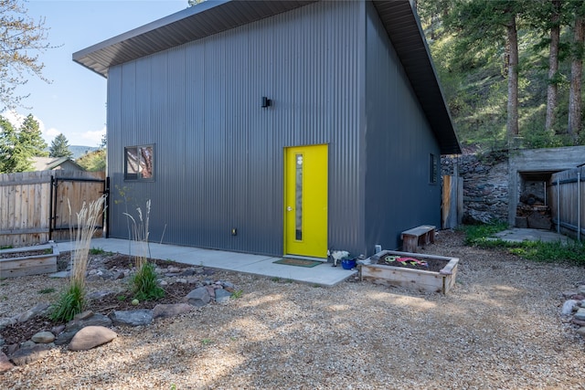view of outbuilding with fence