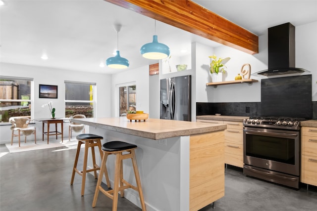 kitchen featuring exhaust hood, appliances with stainless steel finishes, finished concrete flooring, a kitchen breakfast bar, and a kitchen island