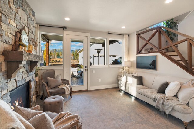 736 Cottonwood Ct, Whitefish, MT 59937 - living area with healthy amount of natural light, recessed lighting, and a stone fireplace