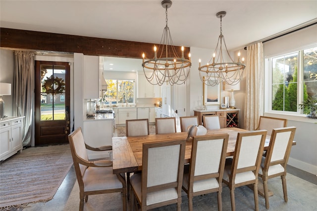736 Cottonwood Ct, Whitefish, MT 59937 - dining room with a chandelier, plenty of natural light, and finished concrete flooring