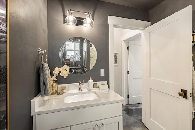 736 Cottonwood Ct, Whitefish, MT 59937 - bathroom featuring vanity, concrete floors, and a textured wall