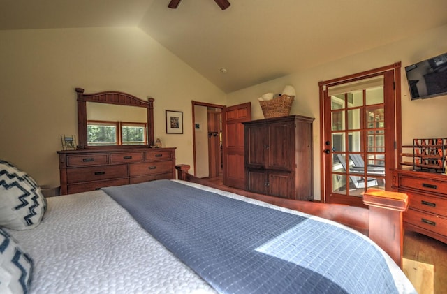 bedroom with a ceiling fan, wood finished floors, and lofted ceiling