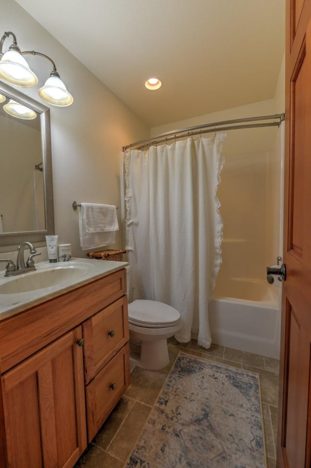 bathroom with vanity, tile patterned flooring, shower / tub combo with curtain, toilet, and recessed lighting