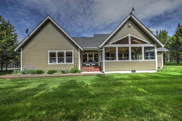 rear view of property with a yard