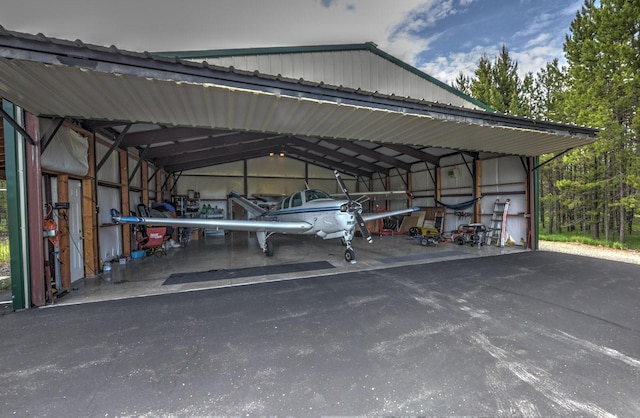 view of parking / parking lot with a detached carport