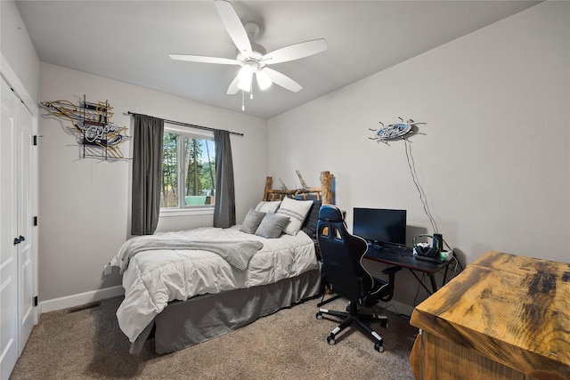 bedroom with carpet floors, a ceiling fan, baseboards, and visible vents