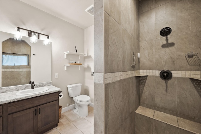 full bath with vanity, tile patterned floors, walk in shower, and toilet