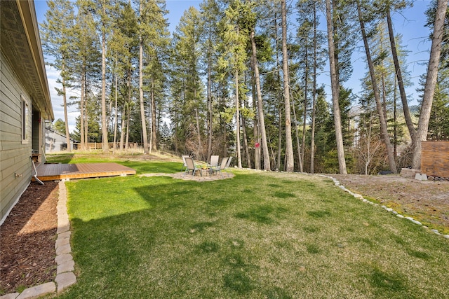 view of yard with a wooden deck