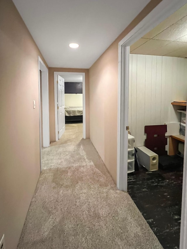 hall with carpet flooring