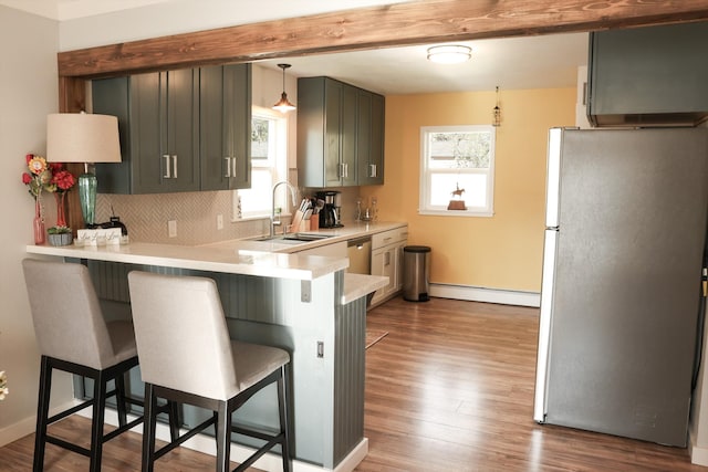 2060 Schilling St, Missoula, MT 59801 - kitchen with a sink, appliances with stainless steel finishes, a kitchen breakfast bar, and a healthy amount of sunlight