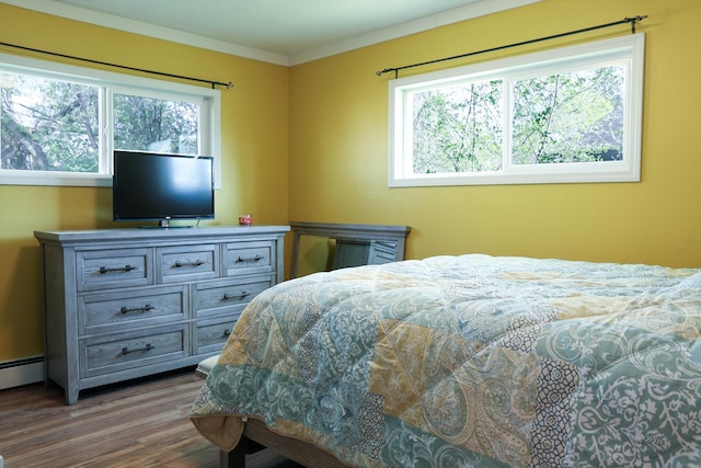 2060 Schilling St, Missoula, MT 59801 - bedroom featuring baseboard heating, ornamental molding, and wood finished floors
