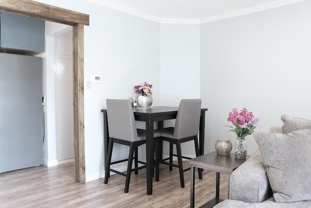 2060 Schilling St, Missoula, MT 59801 - dining room with crown molding, baseboards, and light wood-style floors