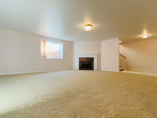 7 Brookside, Missoula, MT 59802 - unfurnished living room featuring stairs, baseboards, and a fireplace