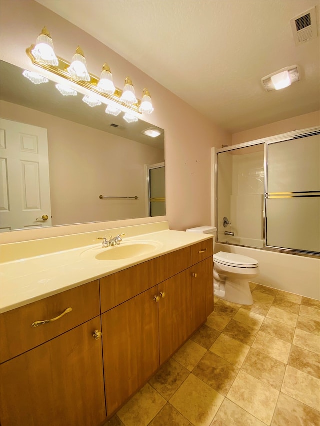 7 Brookside, Missoula, MT 59802 - full bath featuring toilet, visible vents, combined bath / shower with glass door, and vanity