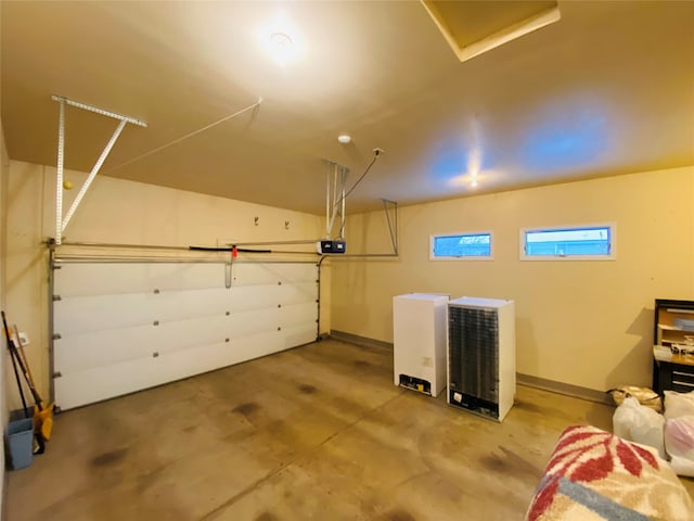 7 Brookside, Missoula, MT 59802 - garage featuring baseboards and a garage door opener