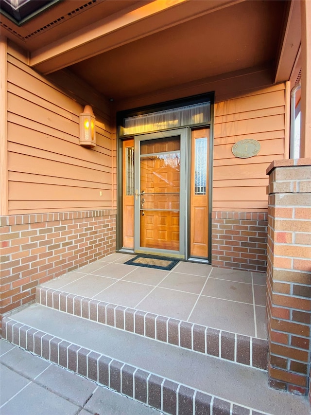 7 Brookside, Missoula, MT 59802 - property entrance with a porch and brick siding