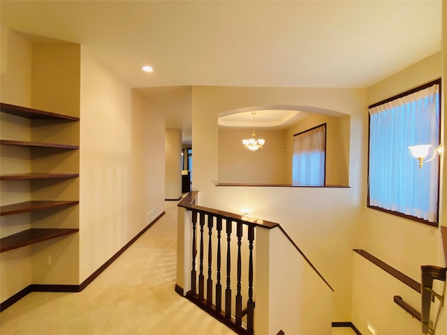 7 Brookside, Missoula, MT 59802 - hall with baseboards, arched walkways, recessed lighting, and an upstairs landing
