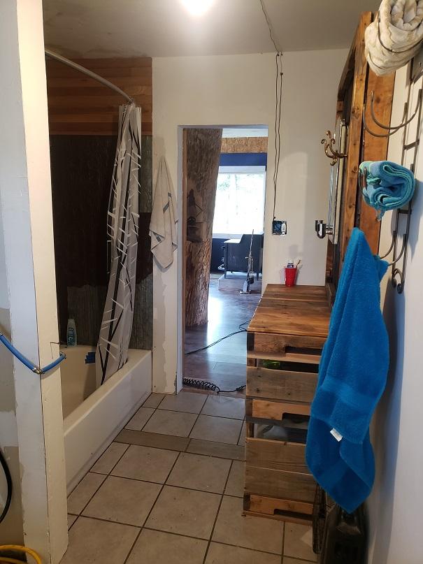 513 Spruce Gulch Rd, Helmville, MT 59843 - bathroom featuring tile patterned flooring and shower / bath combo