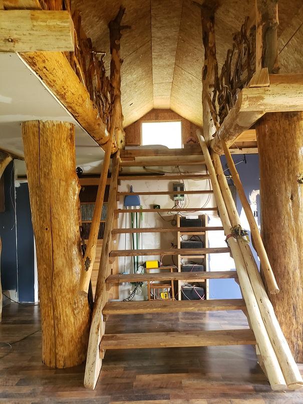 513 Spruce Gulch Rd, Helmville, MT 59843 - stairs with lofted ceiling and wood-type flooring