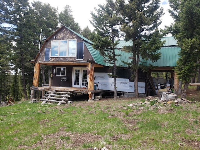 513 Spruce Gulch Rd, Helmville, MT 59843 - rear view of property featuring french doors and metal roof