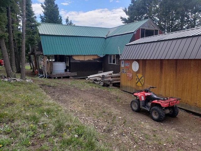 513 Spruce Gulch Rd, Helmville, MT 59843 - view of side of property with metal roof