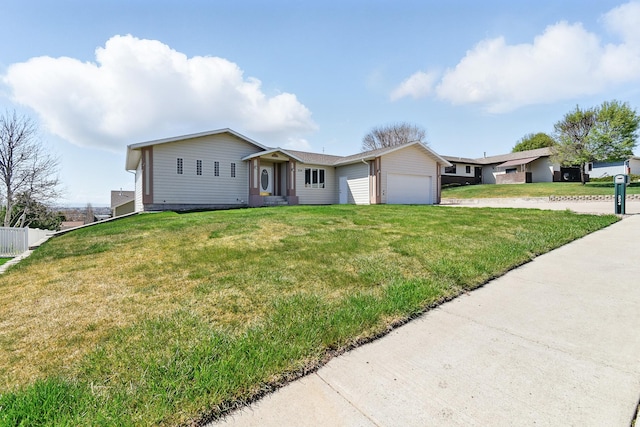 ranch-style house with an attached garage, driveway, and a front lawn