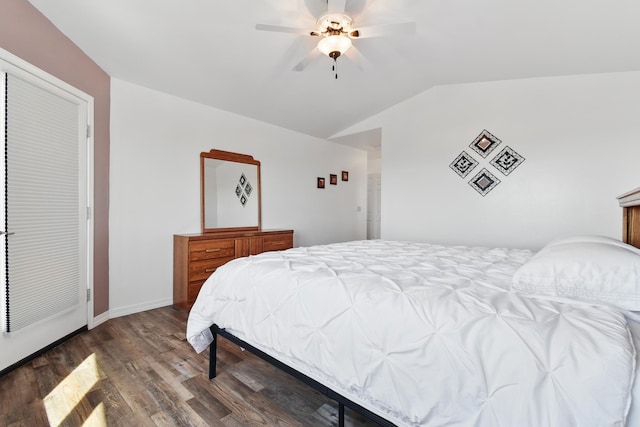 bedroom featuring wood finished floors, baseboards, ceiling fan, and lofted ceiling