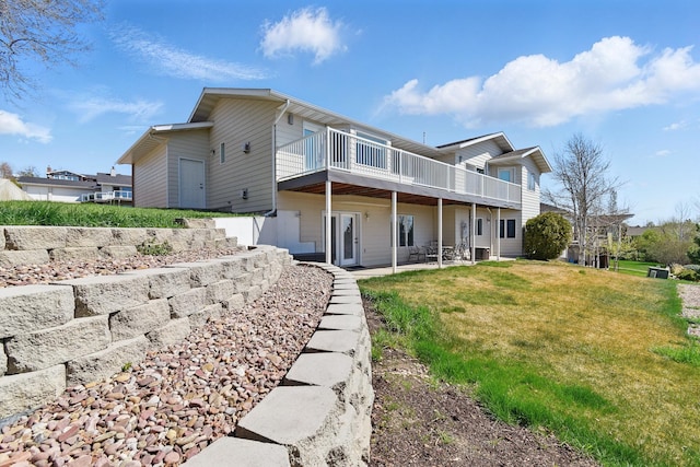 back of house with a patio, a yard, a deck, and cooling unit