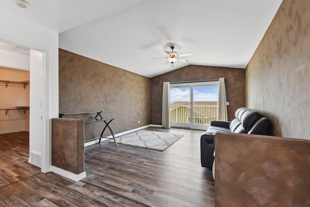living area with wood finished floors, baseboards, ceiling fan, and lofted ceiling