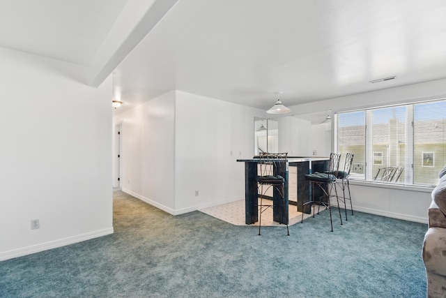 interior space featuring baseboards, carpet, and visible vents