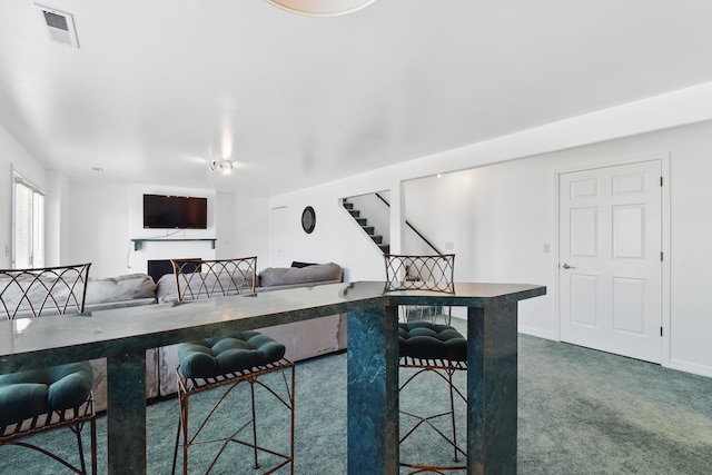 dining area with stairway, baseboards, carpet, and visible vents