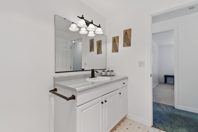 bathroom featuring baseboards and vanity